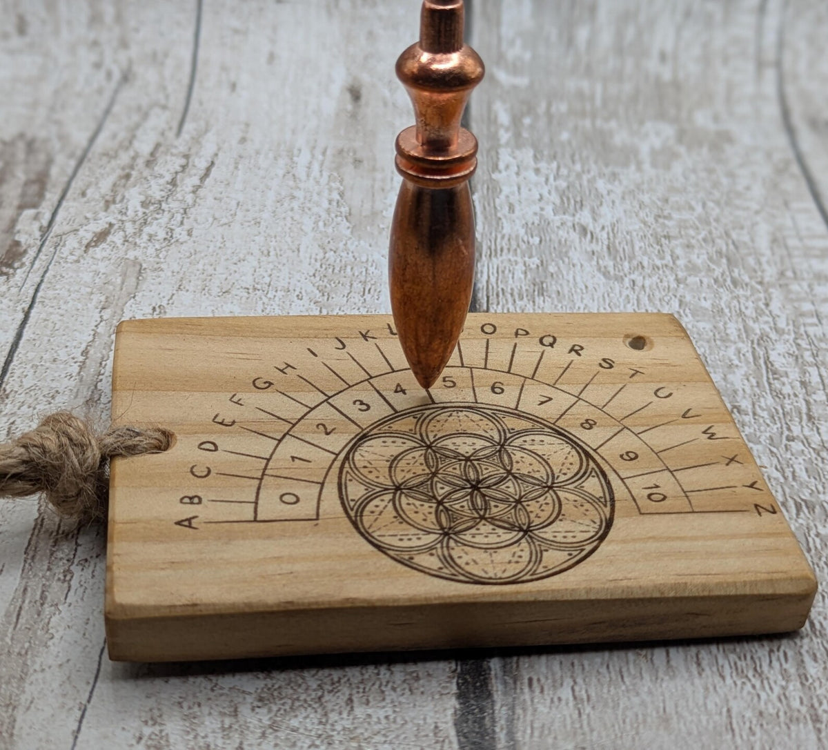 Tulip wood pendulum board with geometric laser print.