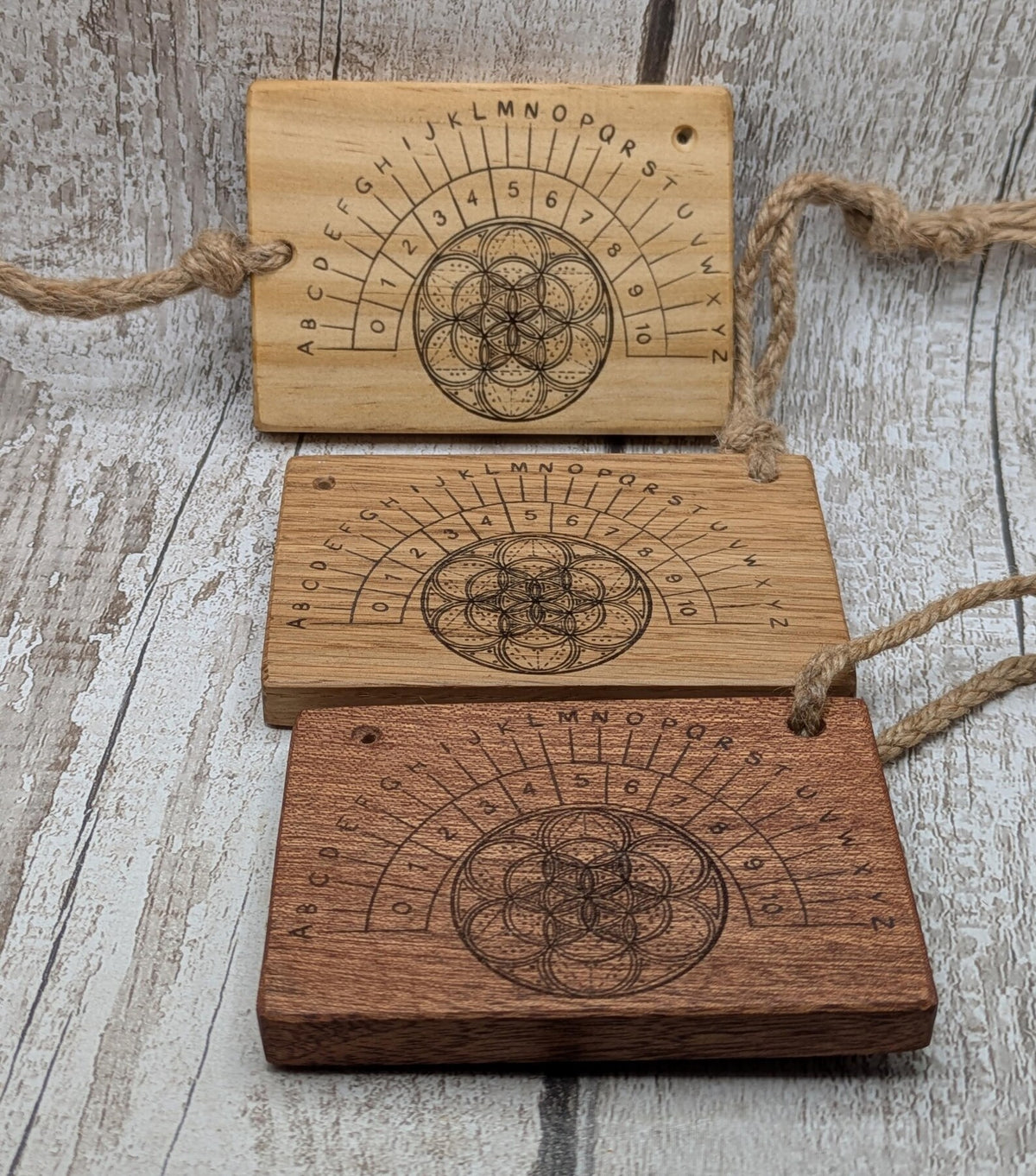 Tulip wood pendulum board with geometric laser print.
