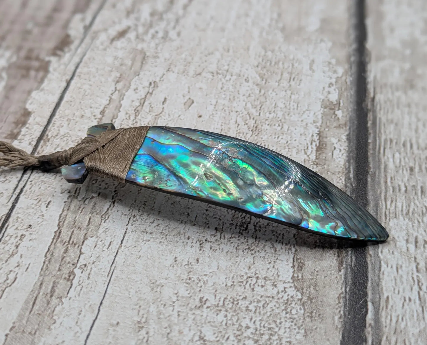 New Zealand Rainbow Pāua Hei Toki Pendant – Iridescent Abalone Adze Necklace sea and ocean themed tonga on Adjustable Cord.