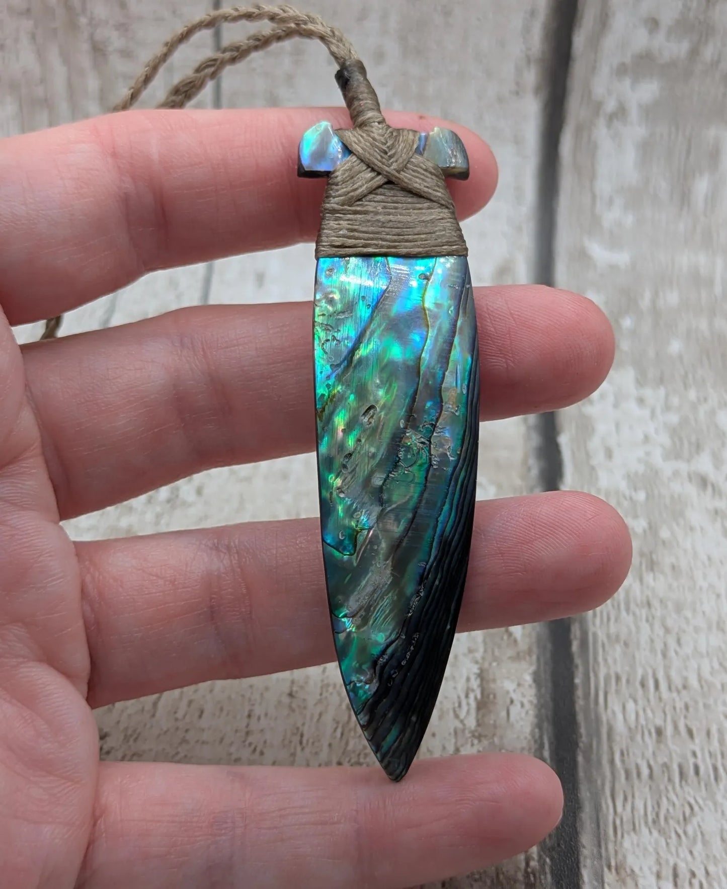 New Zealand Rainbow Pāua Hei Toki Pendant – Iridescent Abalone Adze Necklace sea and ocean themed tonga on Adjustable Cord.