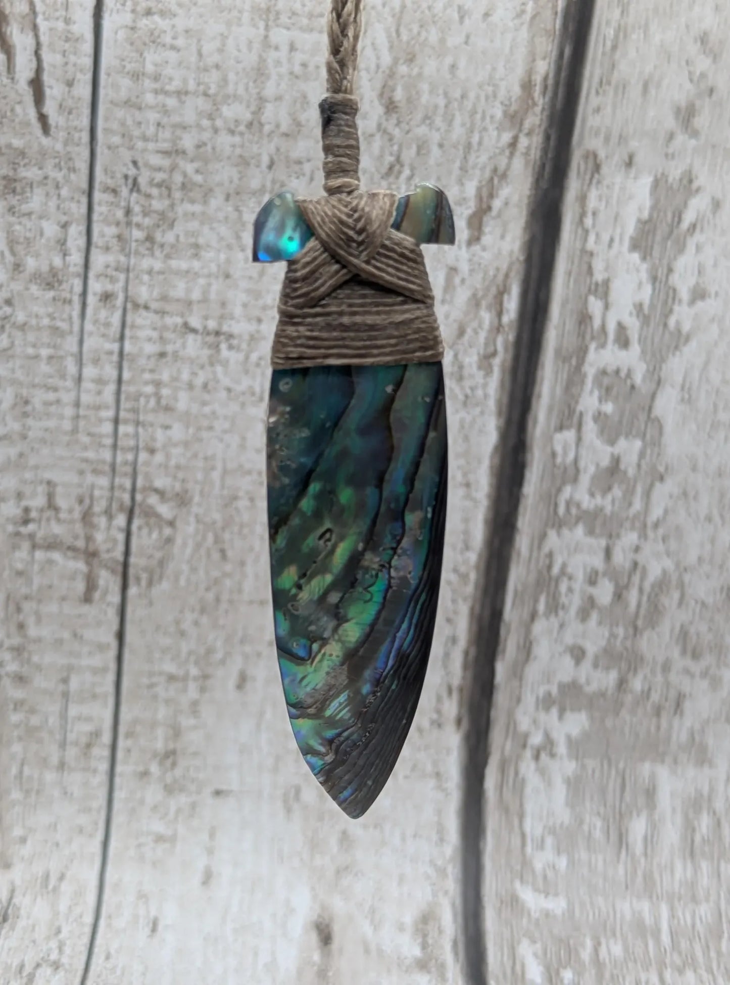 New Zealand Rainbow Pāua Hei Toki Pendant – Iridescent Abalone Adze Necklace sea and ocean themed tonga on Adjustable Cord.