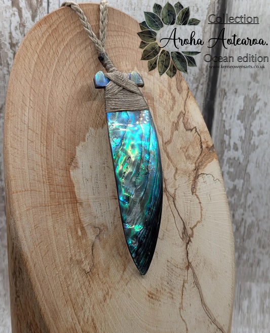 New Zealand Rainbow Pāua Hei Toki Pendant – Iridescent Abalone Adze Necklace sea and ocean themed tonga on Adjustable Cord.