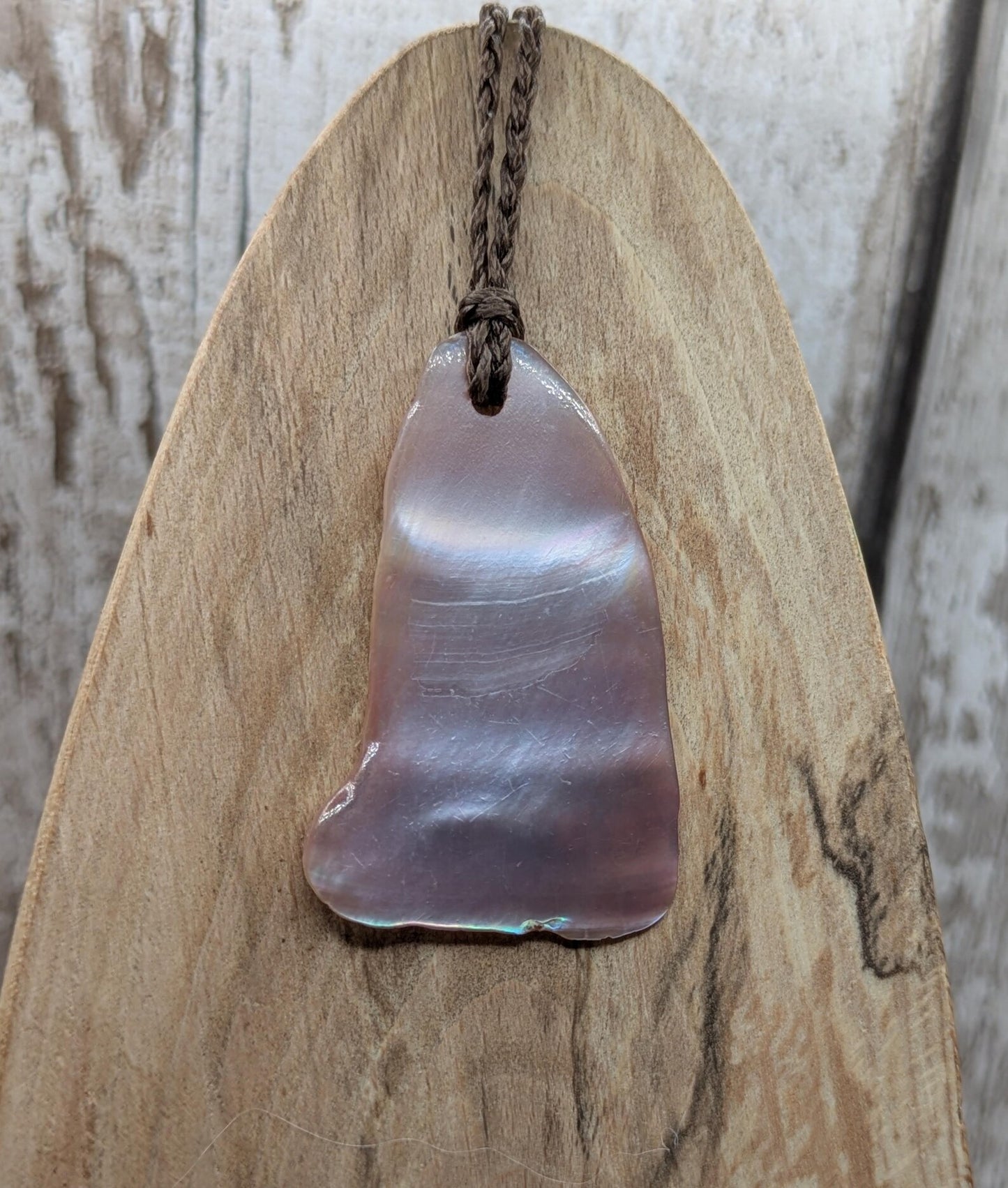 Pink freshwater mussel shell tumbled pendant.