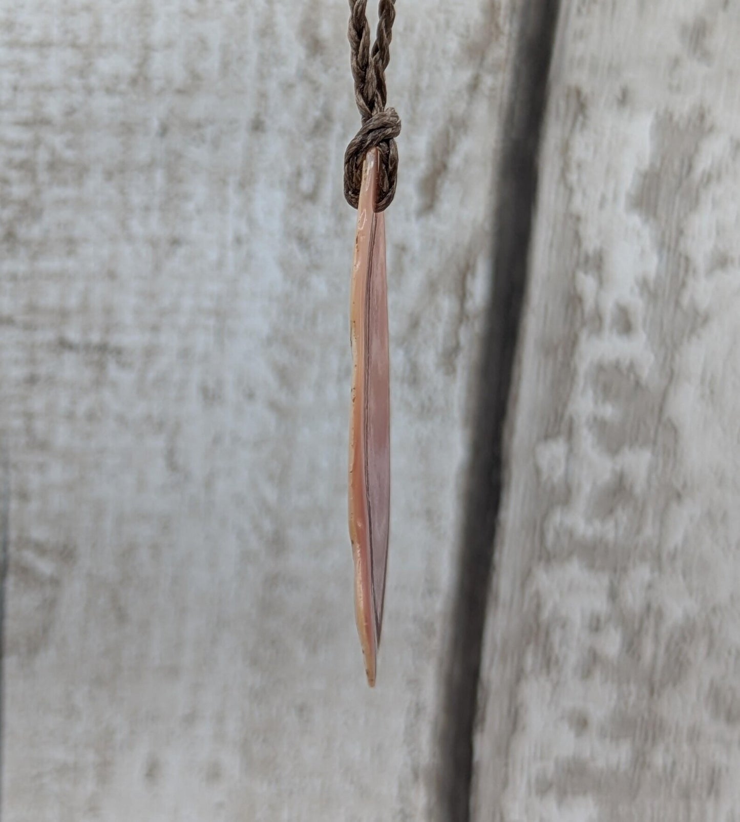 Pink freshwater mussel shell tumbled pendant.