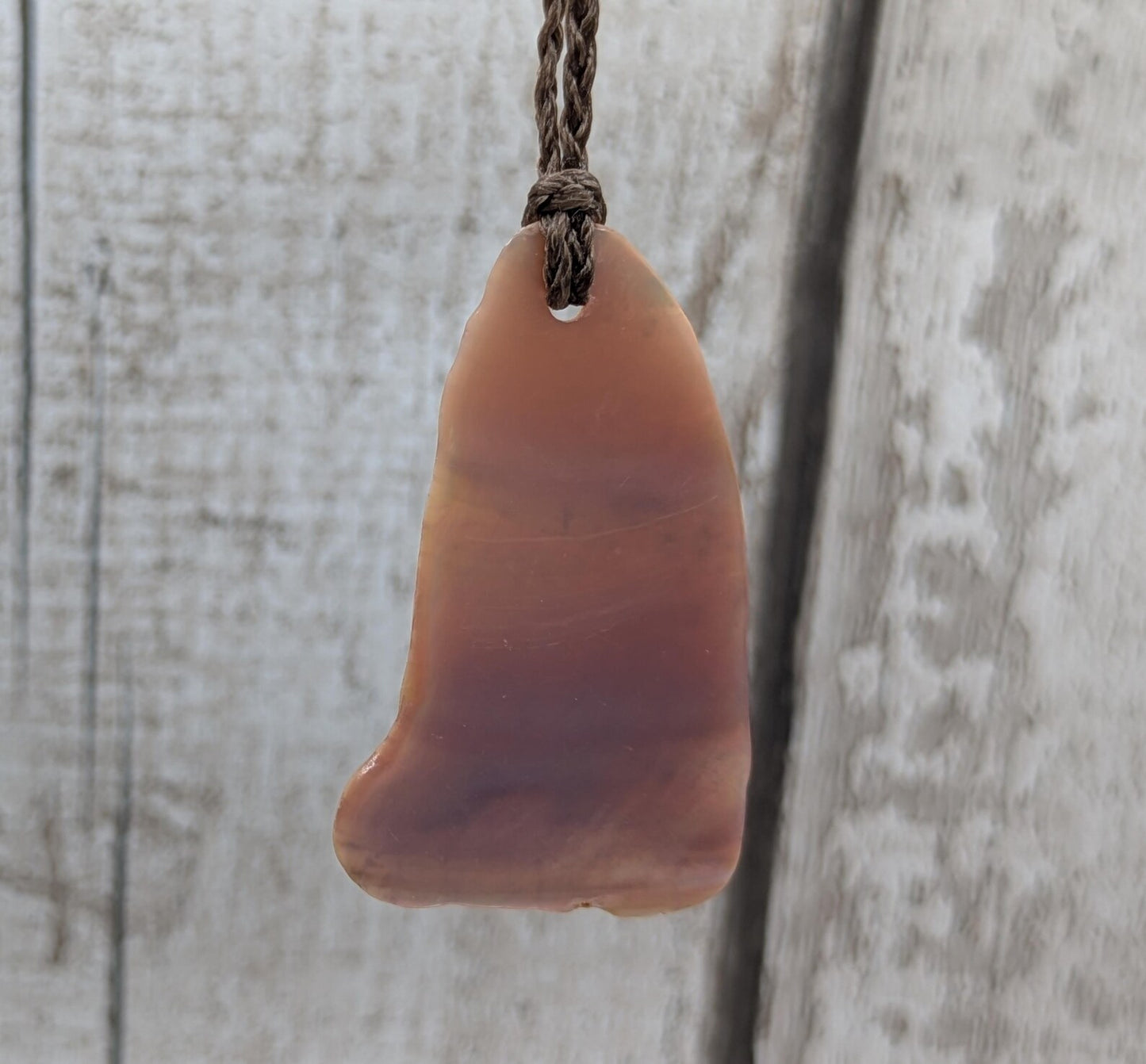 Pink freshwater mussel shell tumbled pendant.