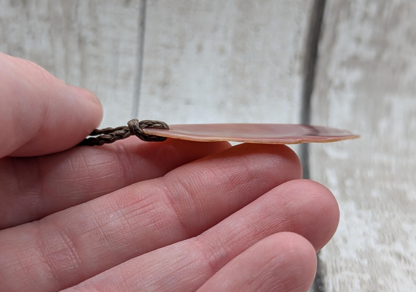 Pink freshwater mussel shell tumbled pendant.