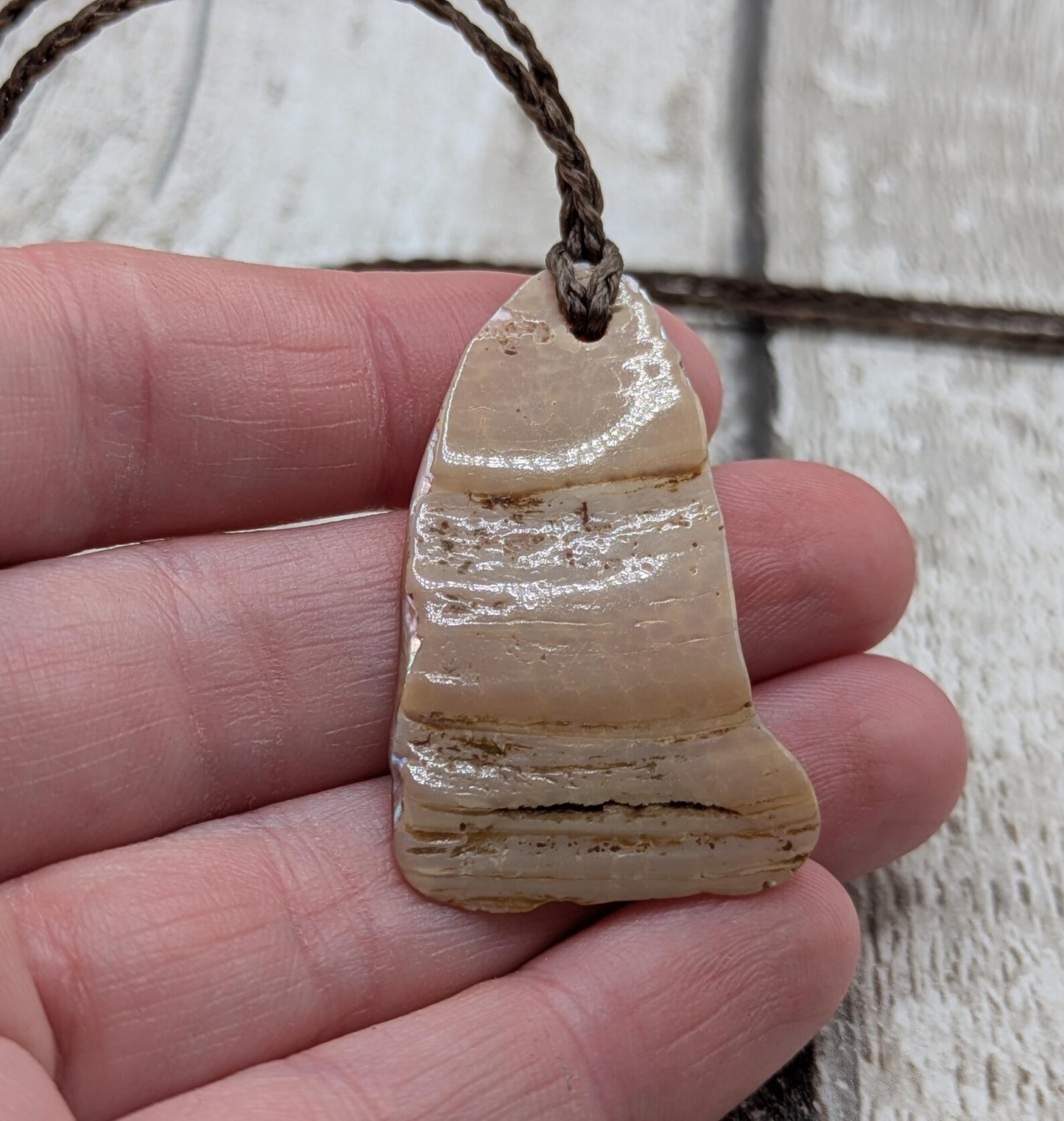 Pink freshwater mussel shell tumbled pendant.