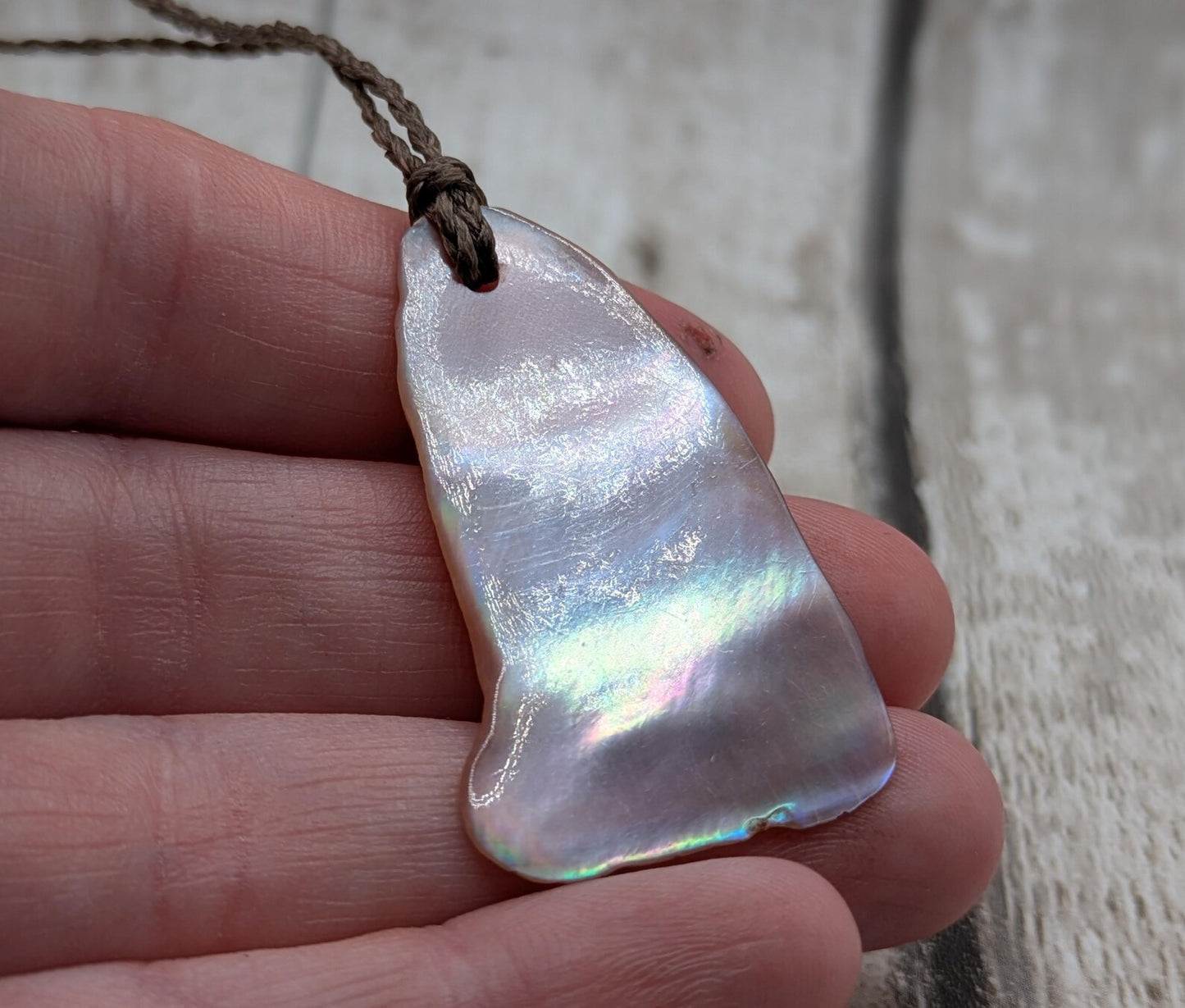 Pink freshwater mussel shell tumbled pendant.