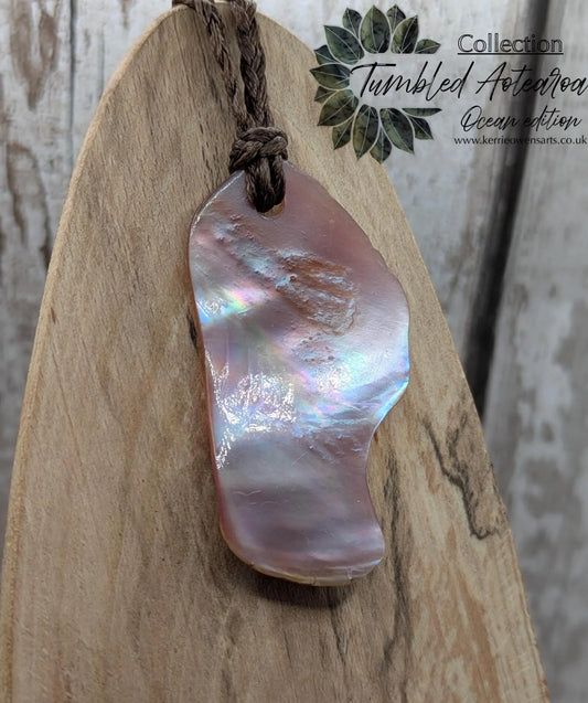 Pink freshwater mussel shell tumbled pendant.