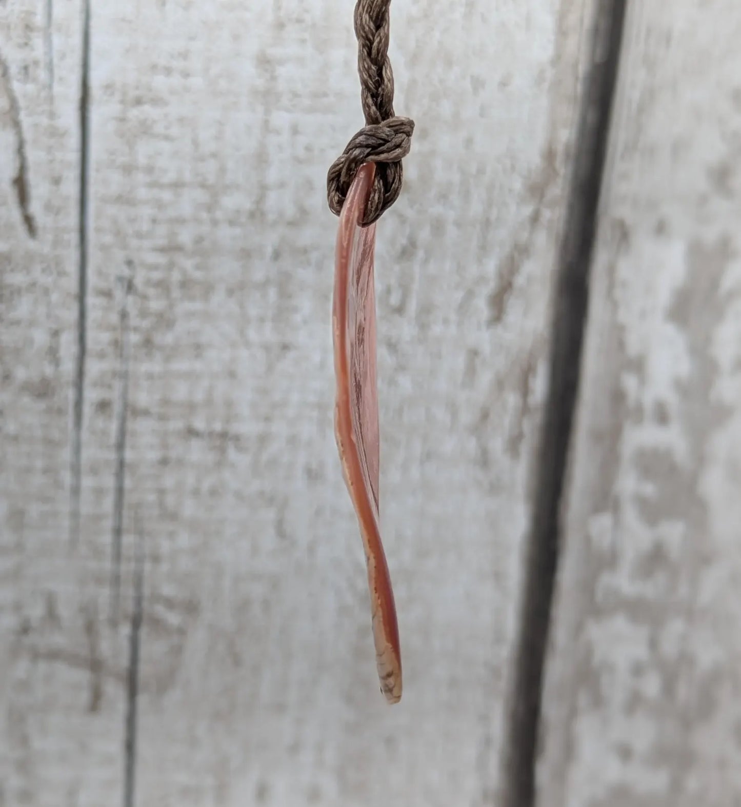 Pink freshwater mussel shell tumbled pendant.