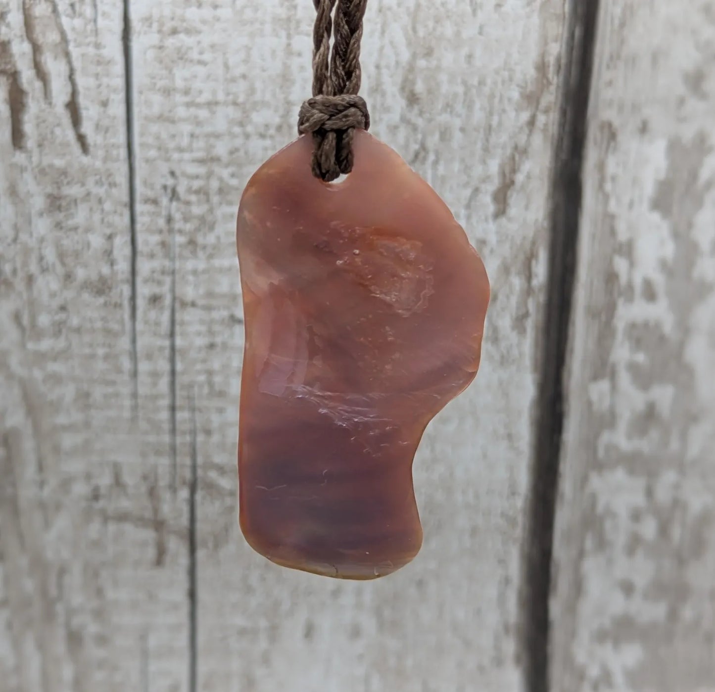Pink freshwater mussel shell tumbled pendant.