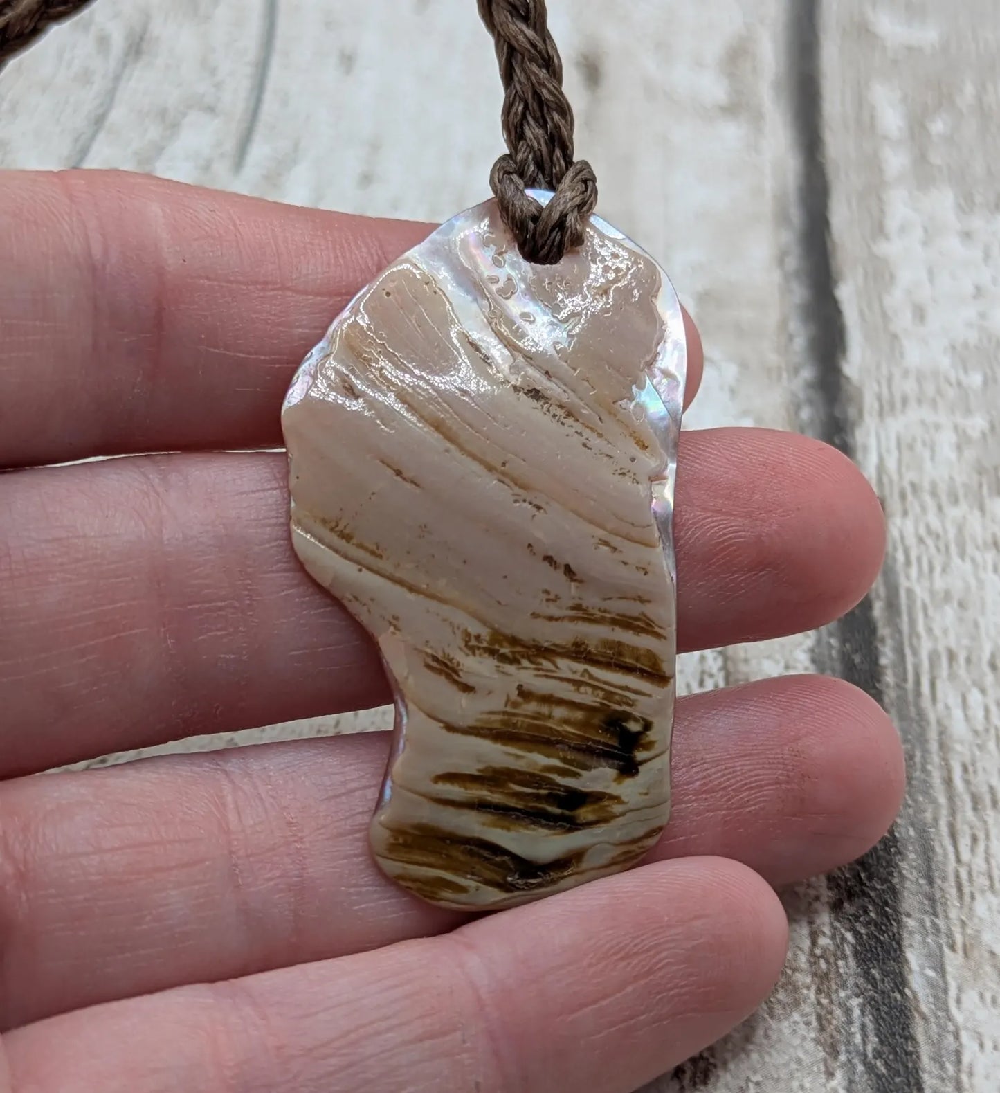 Pink freshwater mussel shell tumbled pendant.