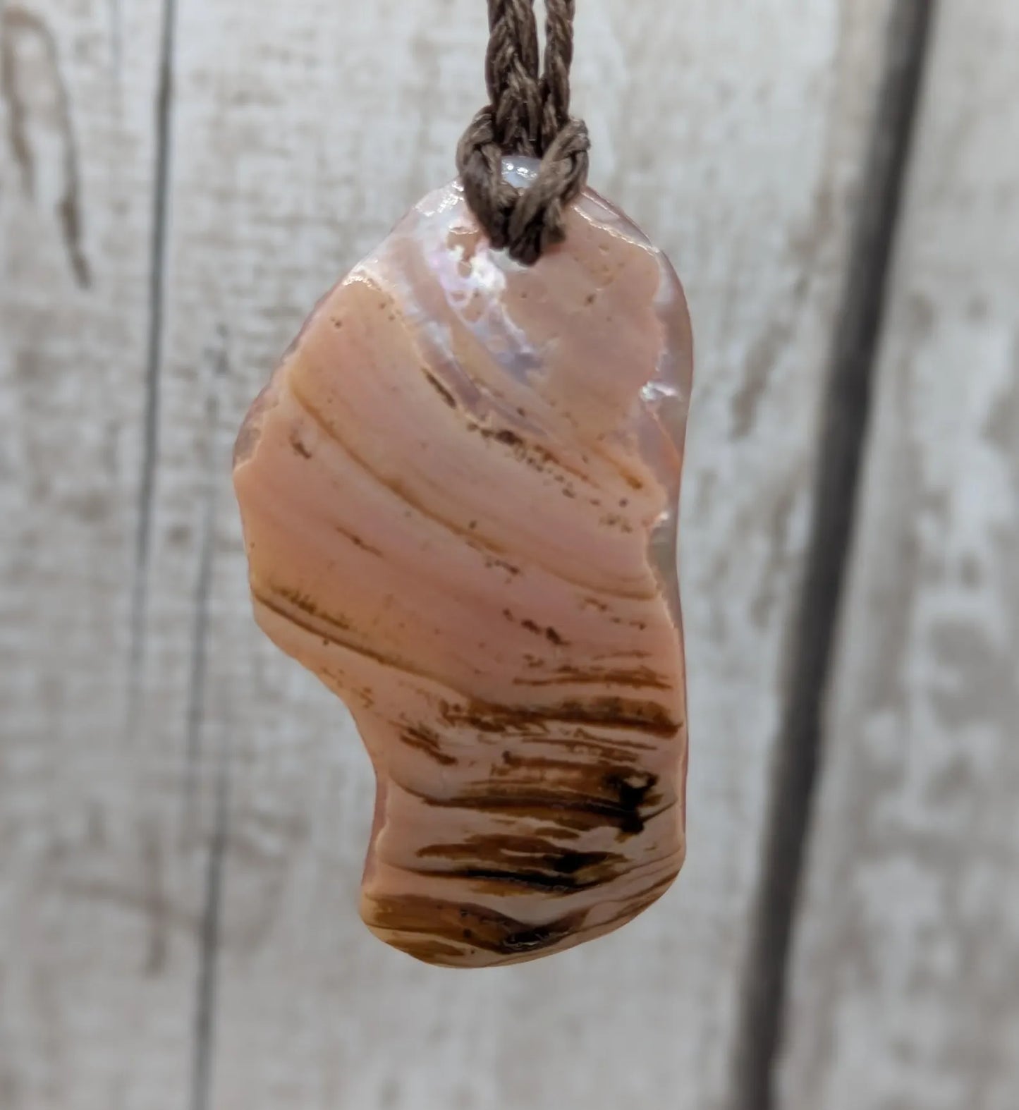 Pink freshwater mussel shell tumbled pendant.