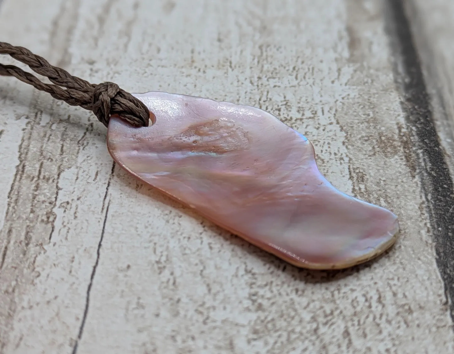 Pink freshwater mussel shell tumbled pendant.