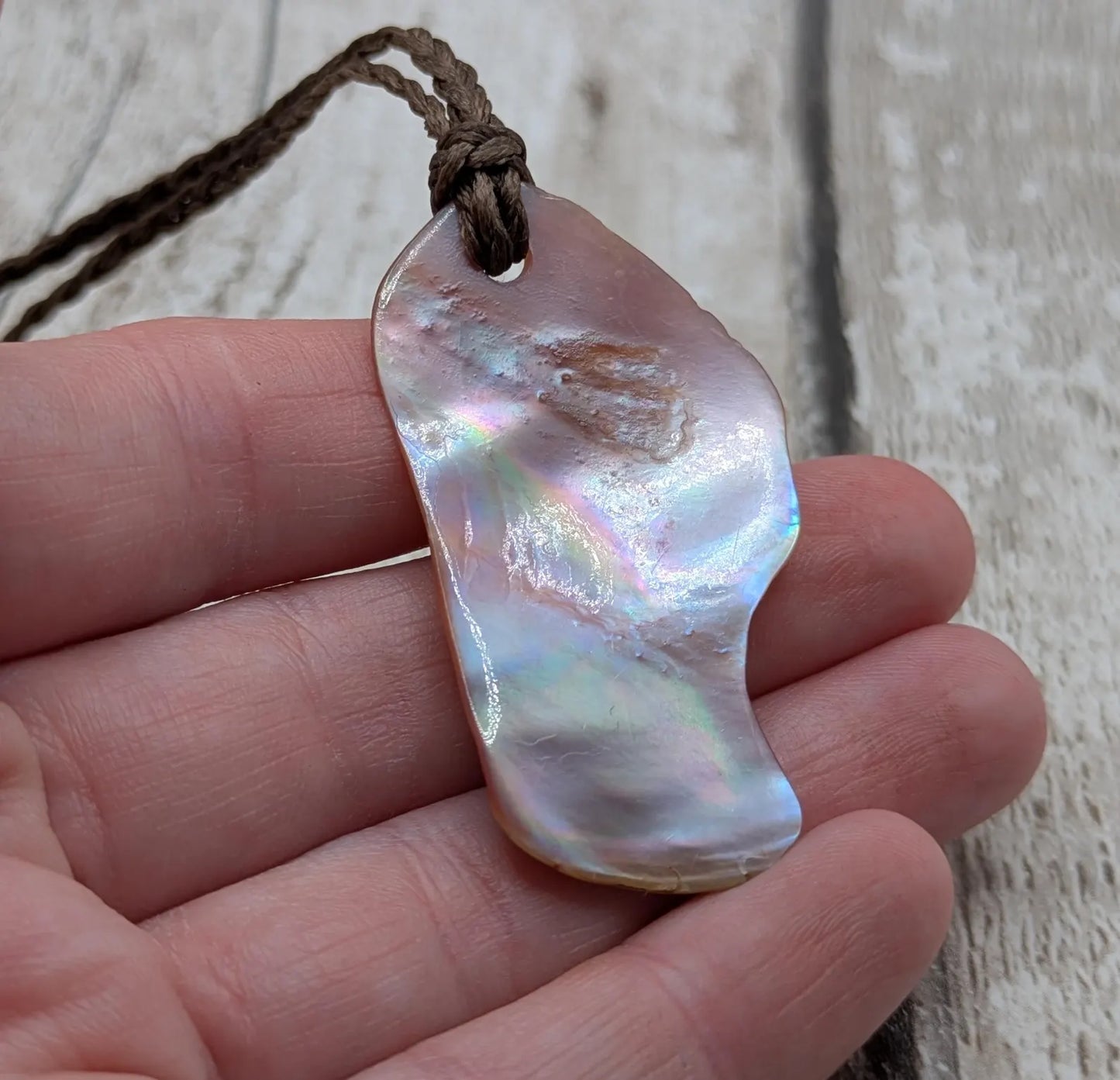 Pink freshwater mussel shell tumbled pendant.