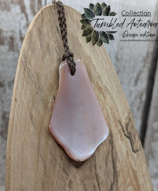New Zealand pink mussel shell tumbled pendant.