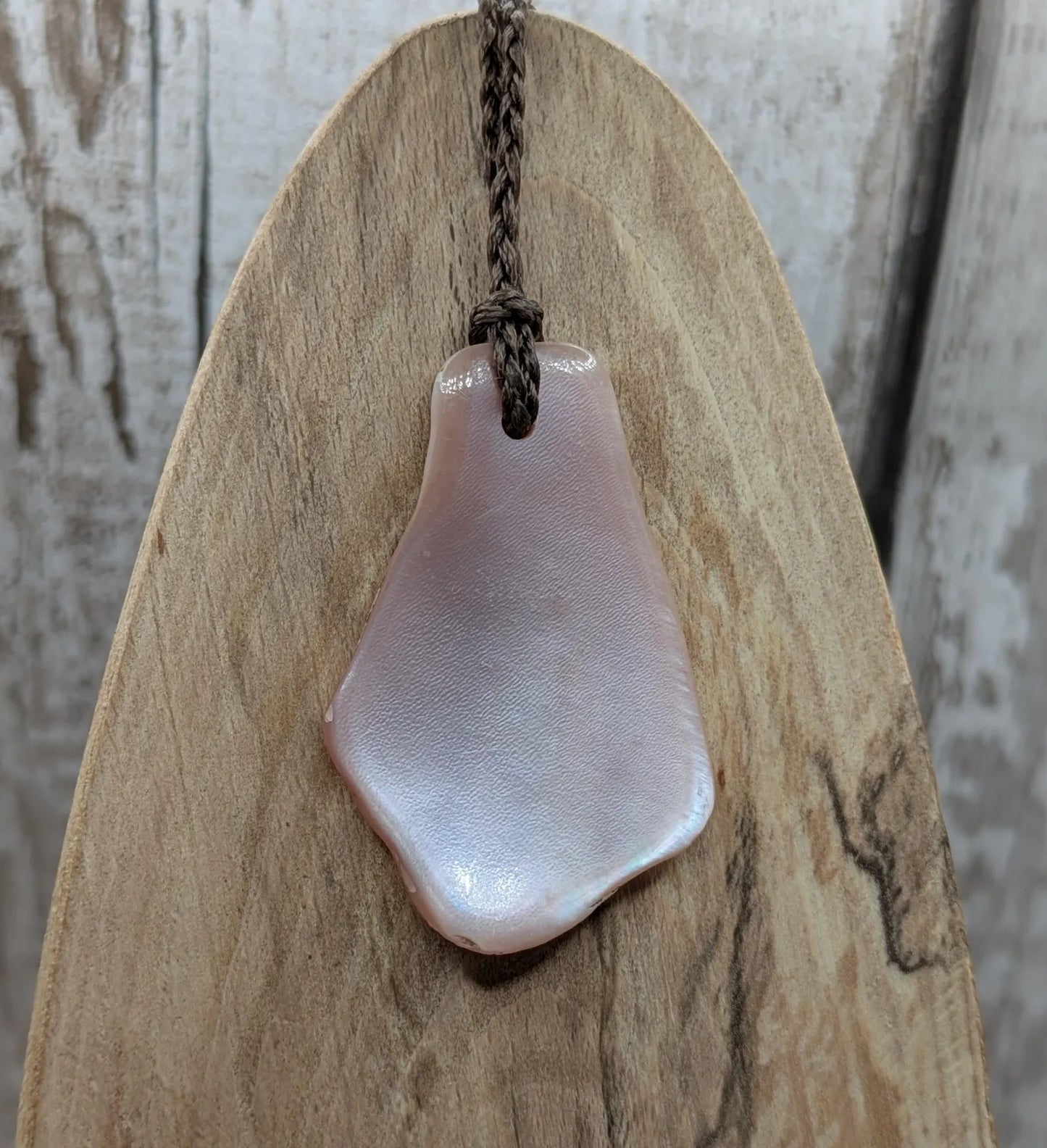 New Zealand pink mussel shell tumbled pendant.