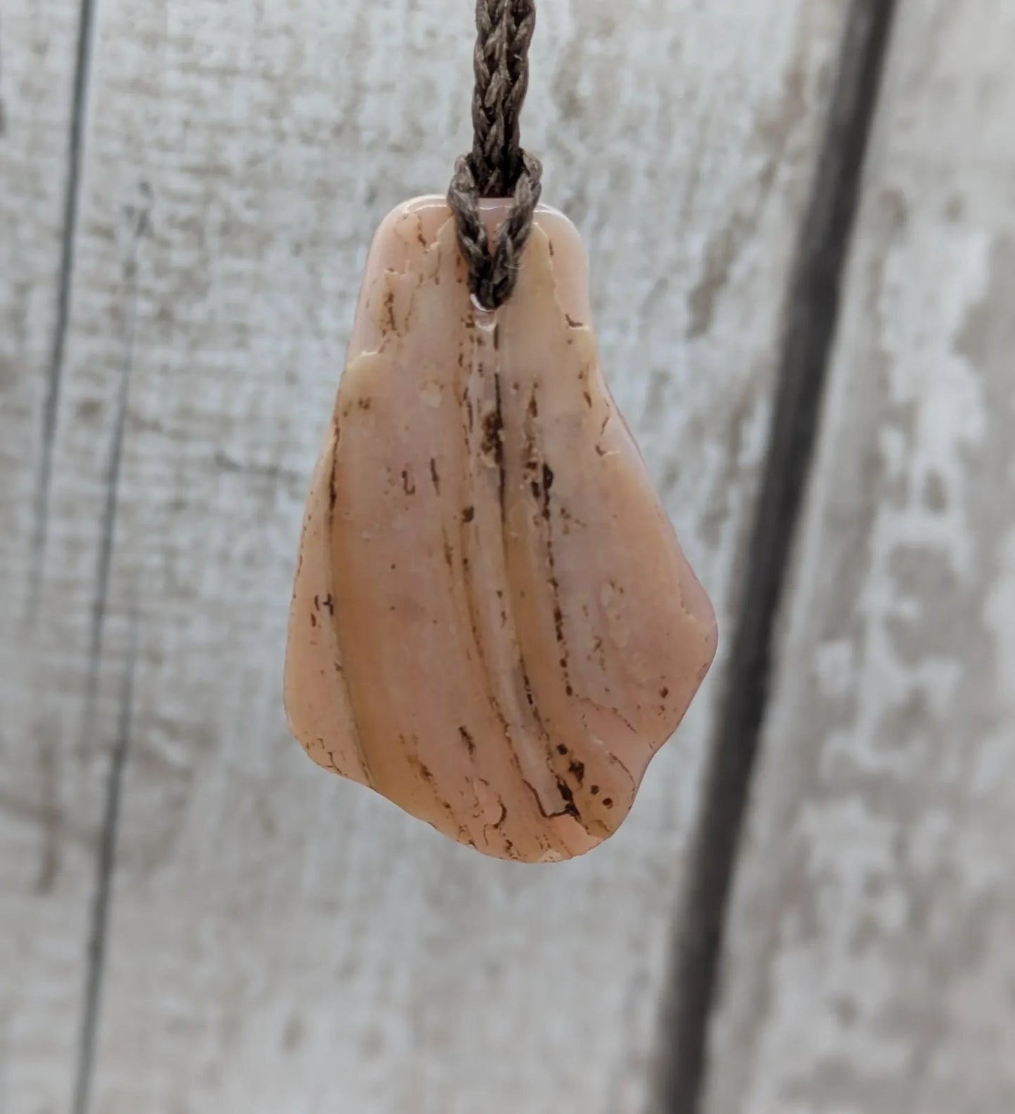New Zealand pink mussel shell tumbled pendant.
