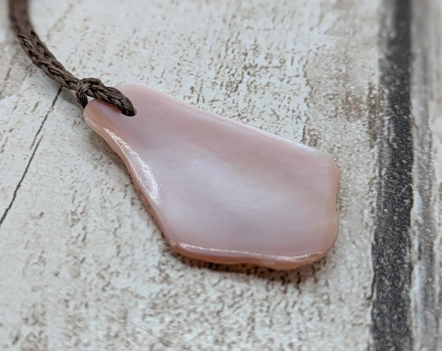 New Zealand pink mussel shell tumbled pendant.