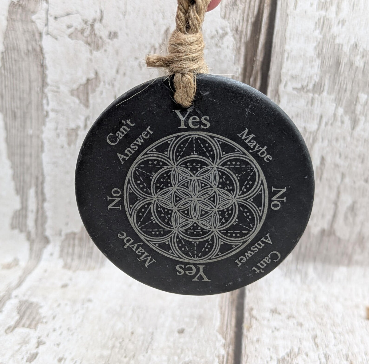Welsh slate pocket pendulum board with geometric design.