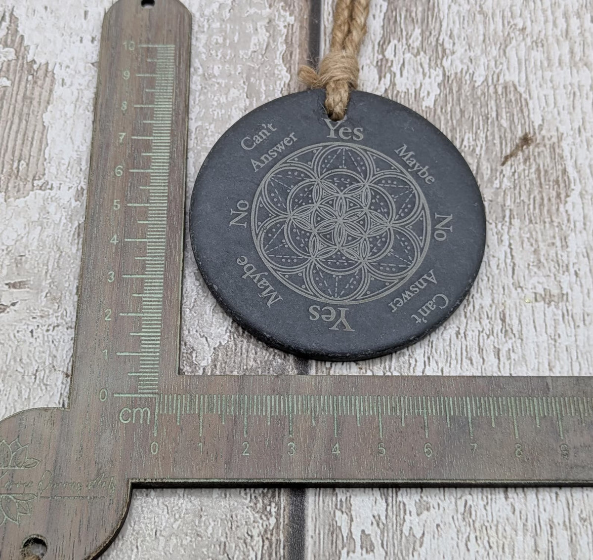 Welsh slate pocket pendulum board with geometric design.