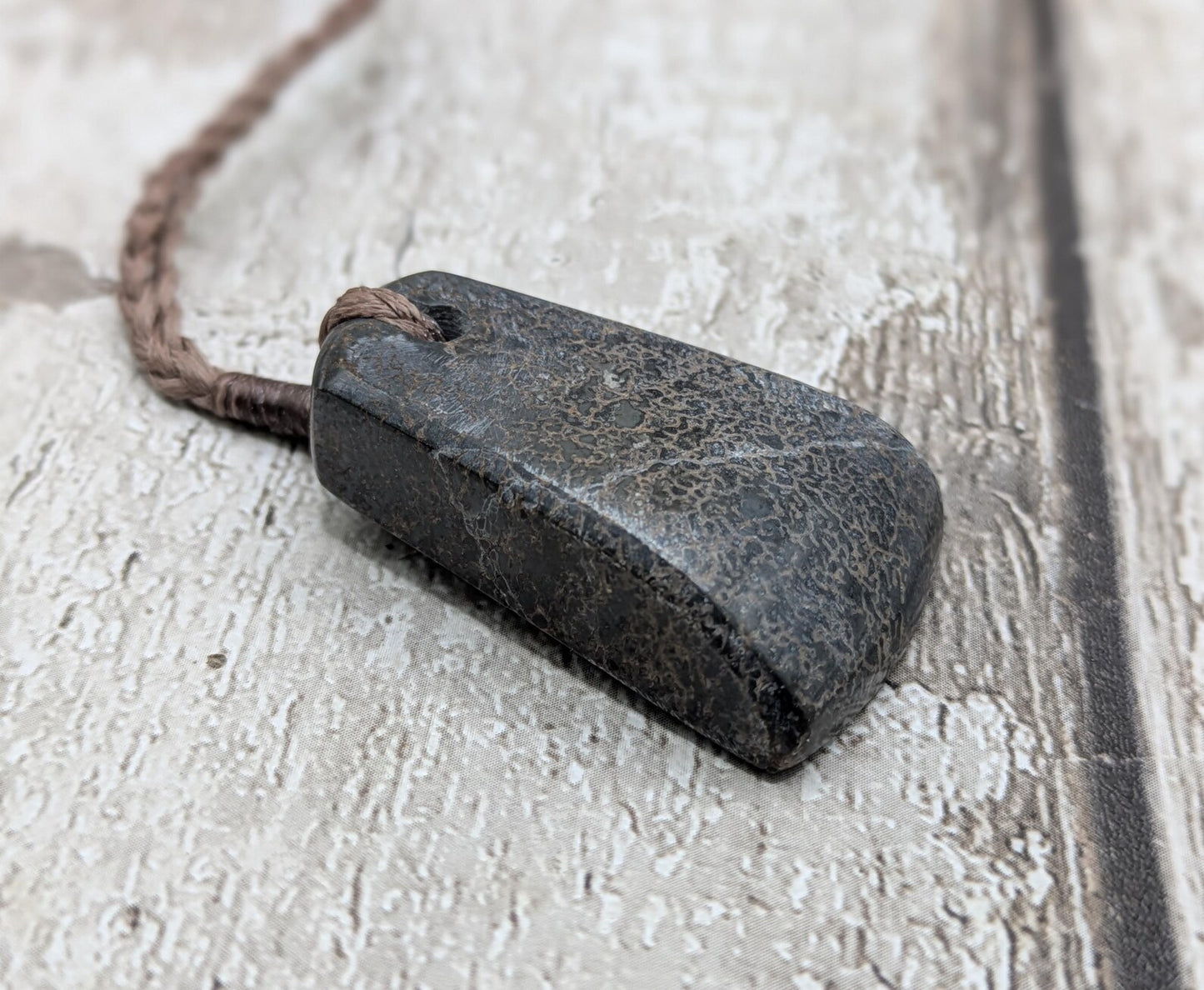 Oxfordshire sourced dinosaur bone slab Toki style pendant.