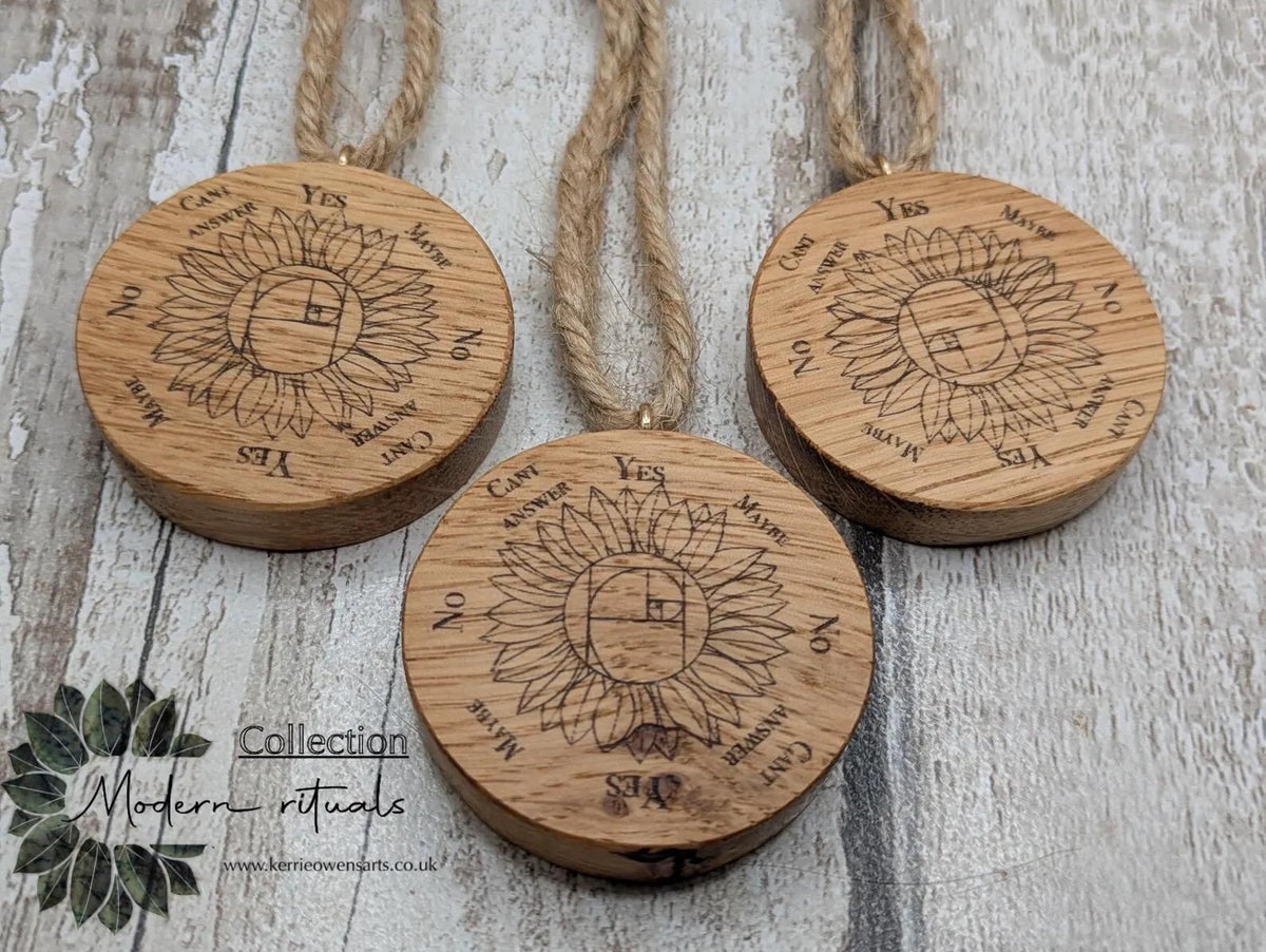 Oak wood mini pocket pendulum board with sunflower design.