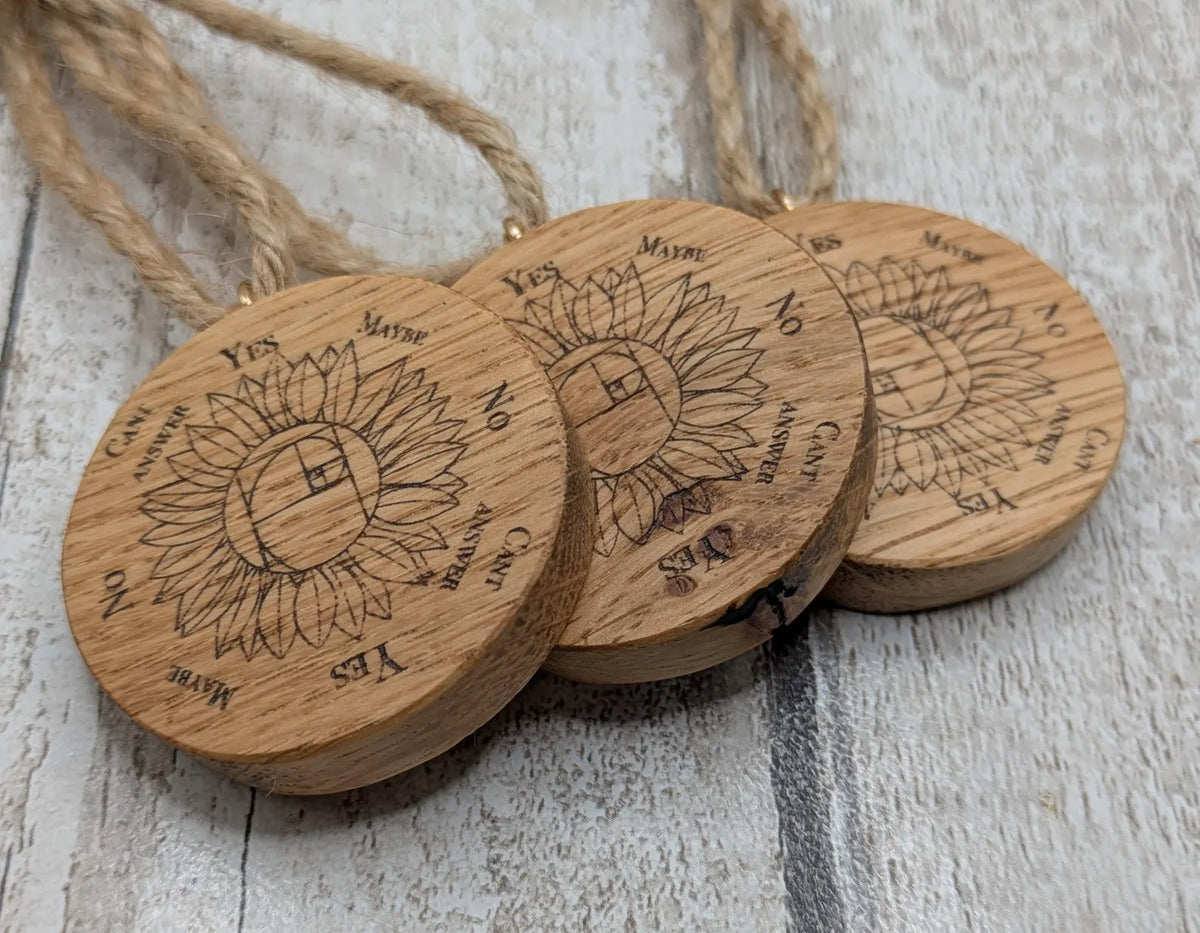 Oak wood mini pocket pendulum board with sunflower design.