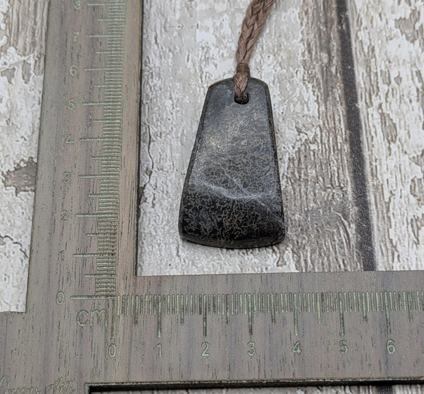 Oxfordshire sourced dinosaur bone slab Toki style pendant.