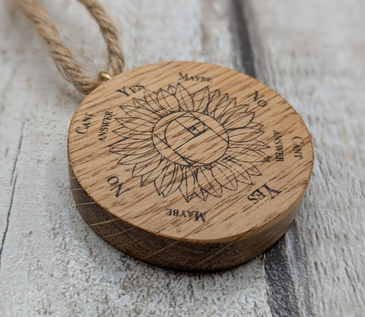 Oak wood mini pocket pendulum board with sunflower design.