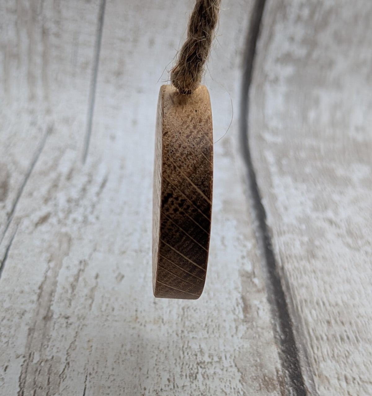 Oak wood mini pocket pendulum board with sunflower design.
