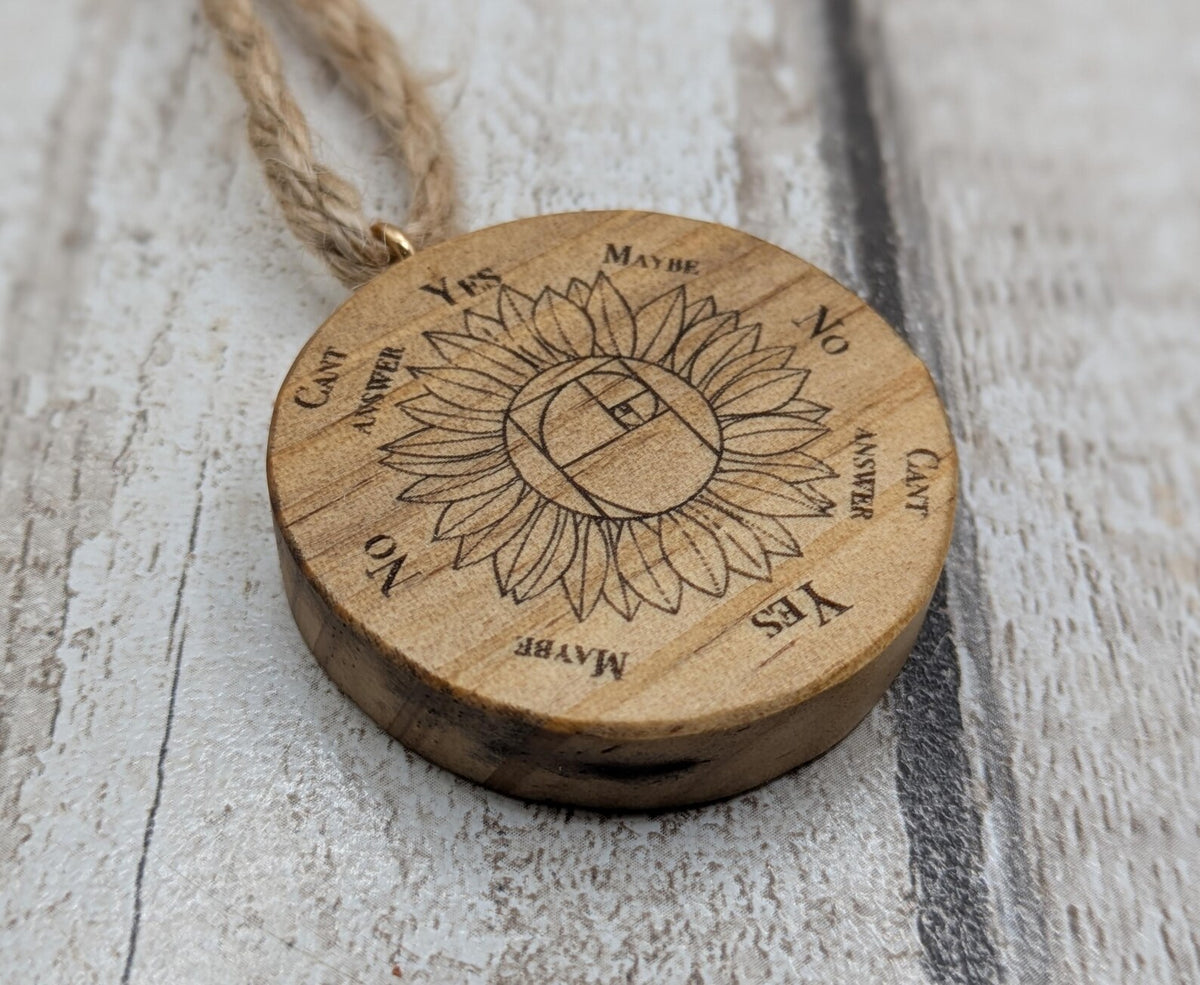 Tulip wood mini pocket pendulum board with sunflower design.