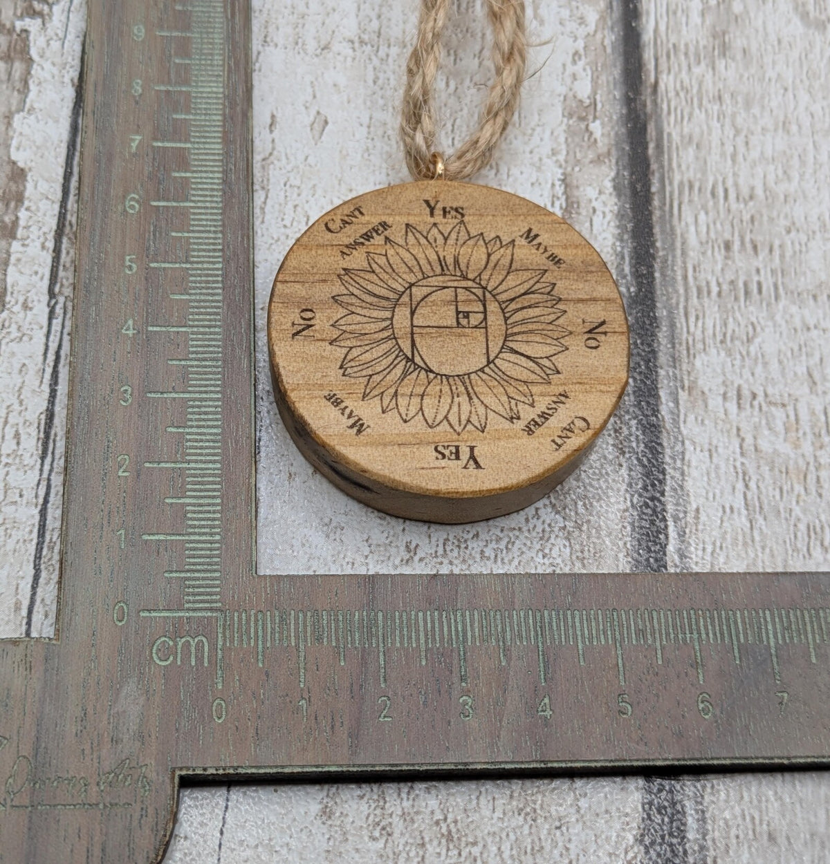 Tulip wood mini pocket pendulum board with sunflower design.