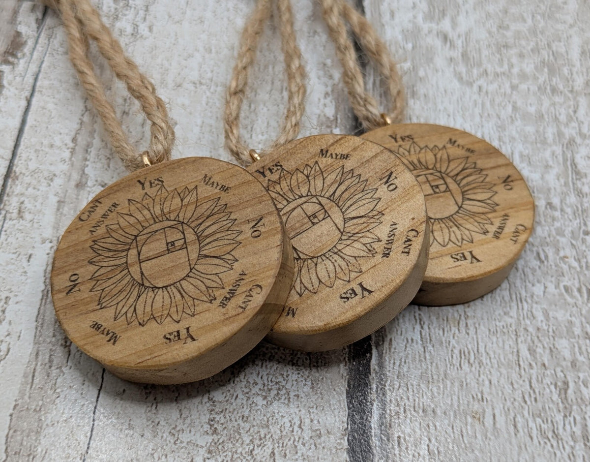 Tulip wood mini pocket pendulum board with sunflower design.