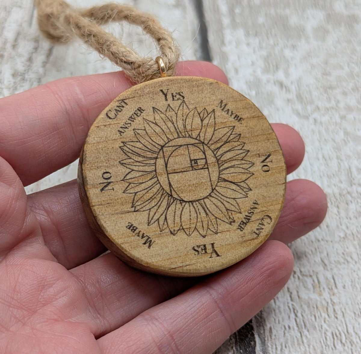 Tulip wood mini pocket pendulum board with sunflower design.