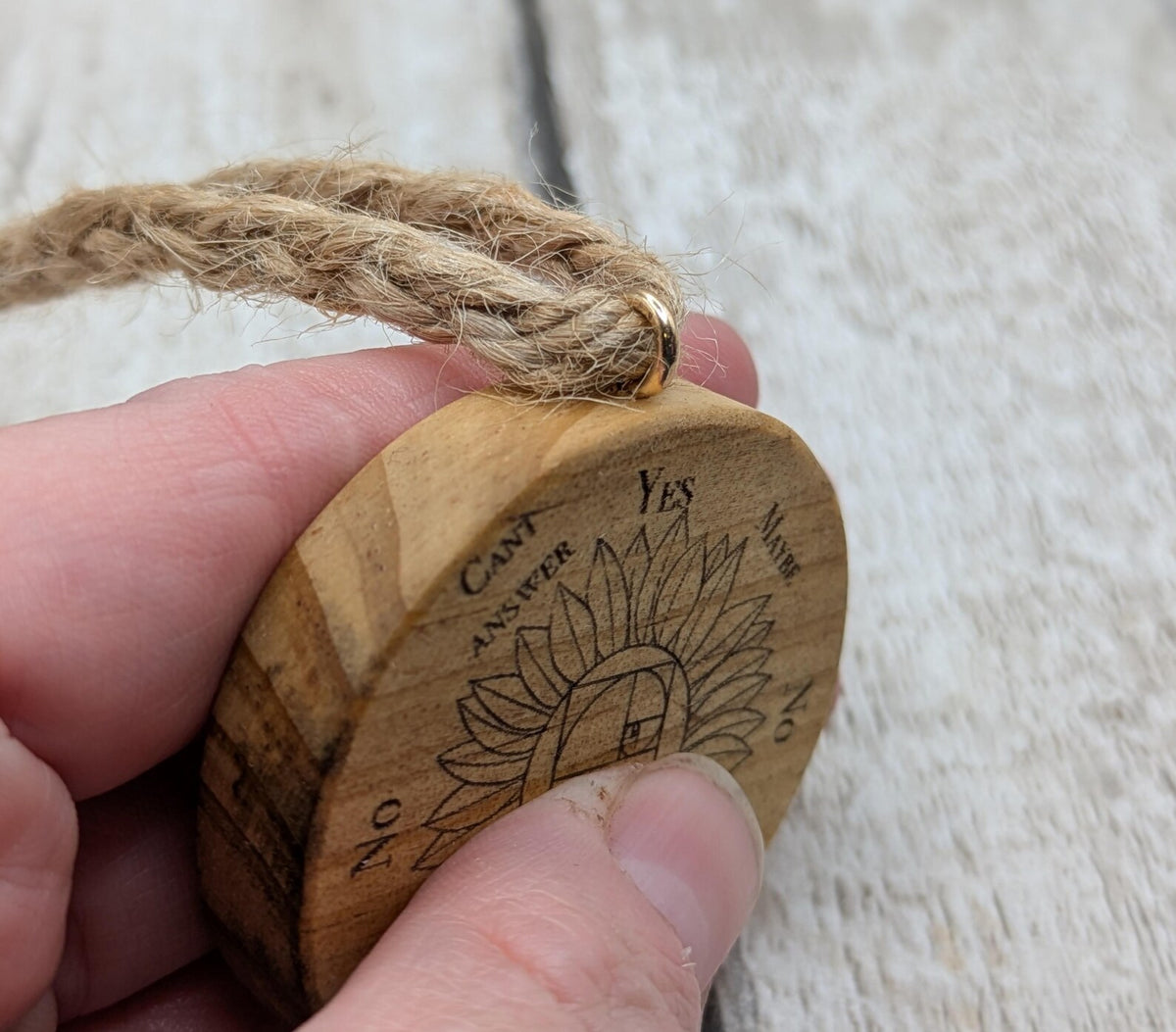 Tulip wood mini pocket pendulum board with sunflower design.