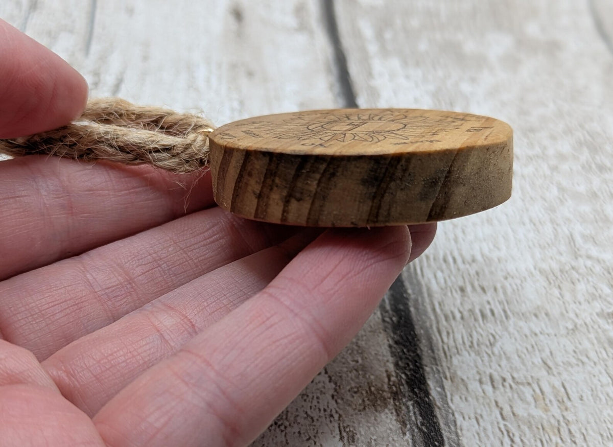Tulip wood mini pocket pendulum board with sunflower design.