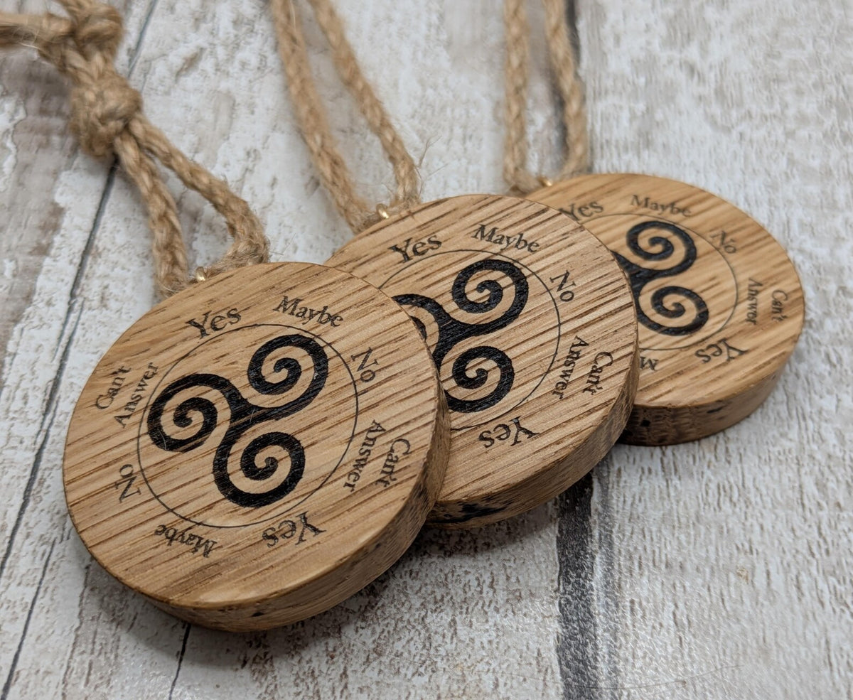 Oak wood mini pocket pendulum boards with triskele design.