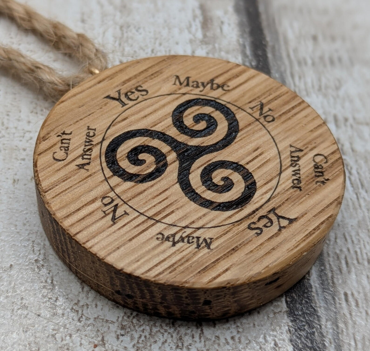 Oak wood mini pocket pendulum boards with triskele design.