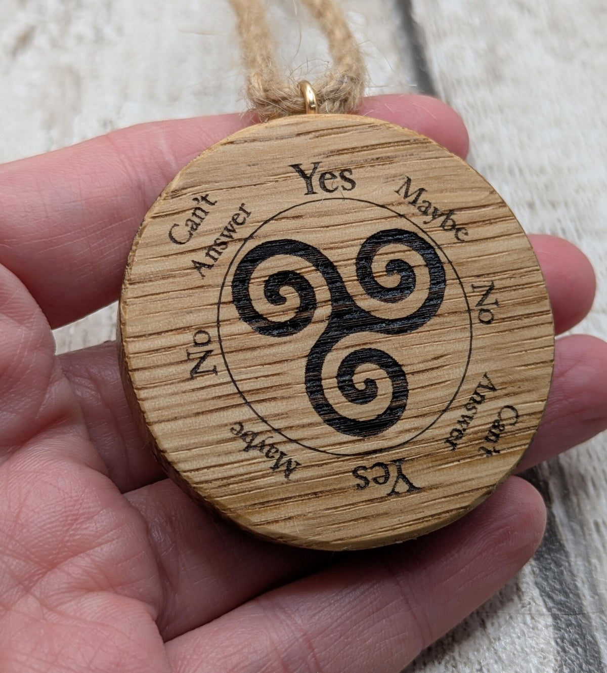 Oak wood mini pocket pendulum boards with triskele design.