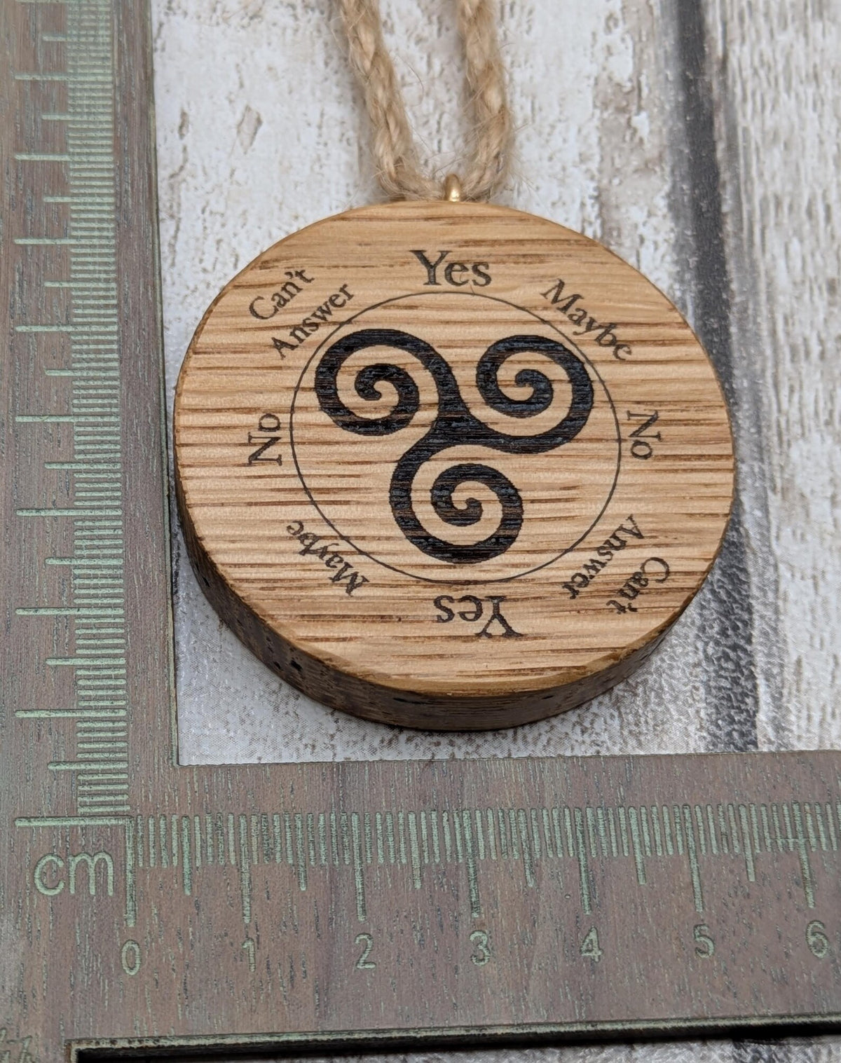 Oak wood mini pocket pendulum boards with triskele design.