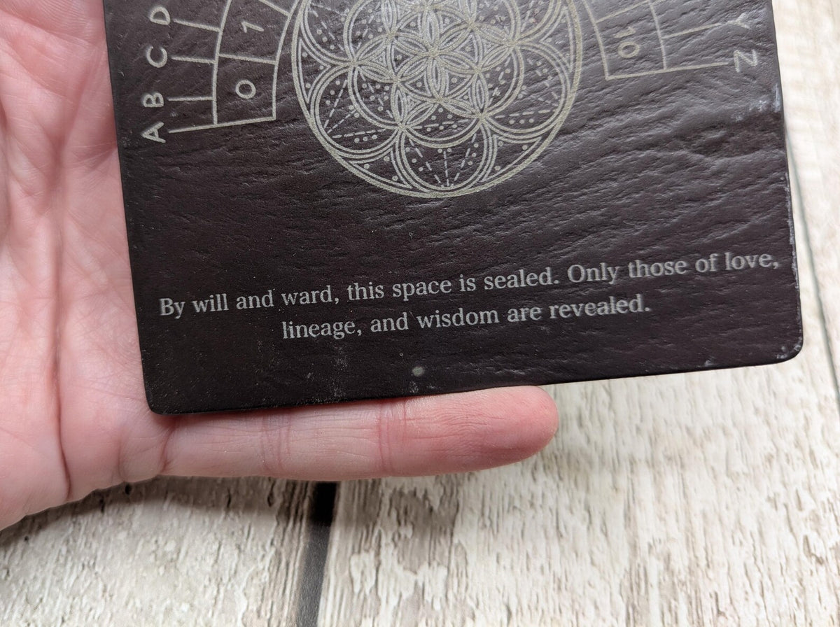 Welsh slate pendulum dowsing board with geometric print.