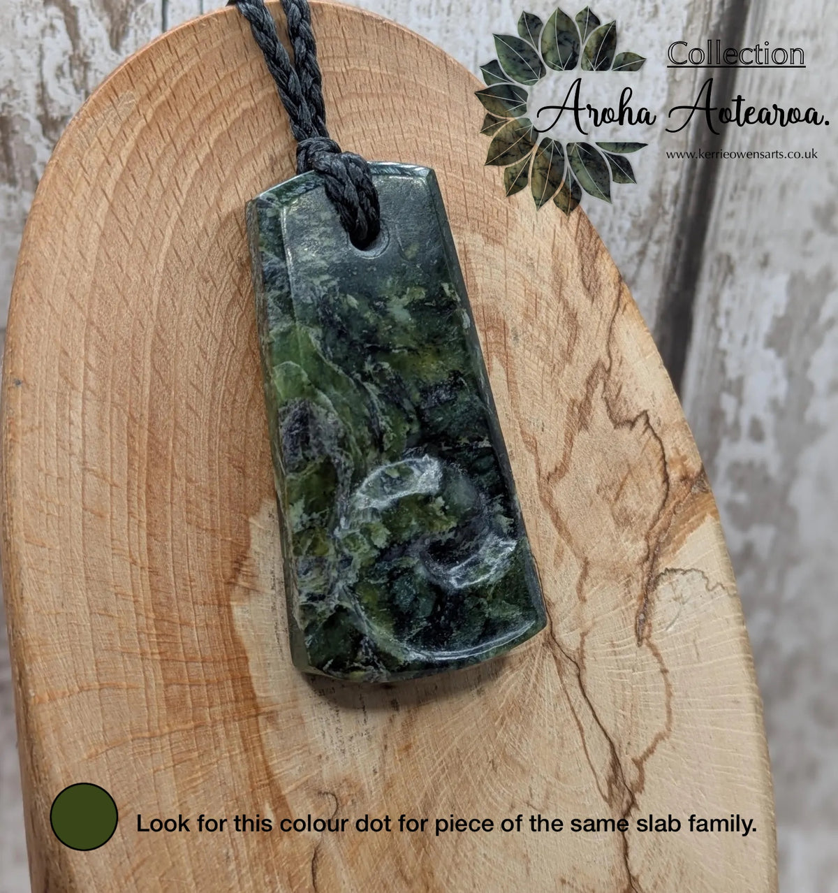 New Zealand Haast pass Douglas creek serpentine pounamu pendant with koru design.