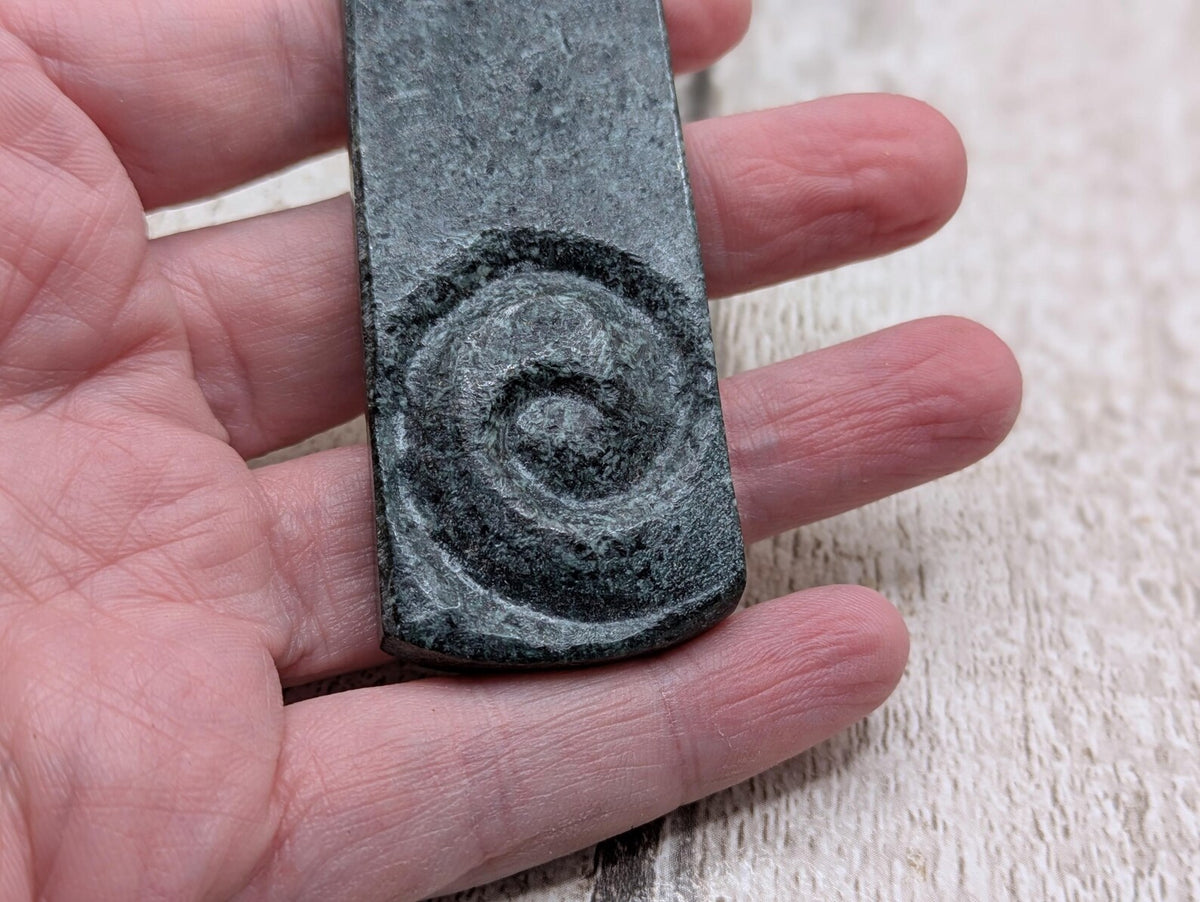 Statement preselli bluestone koru spiral pendant.