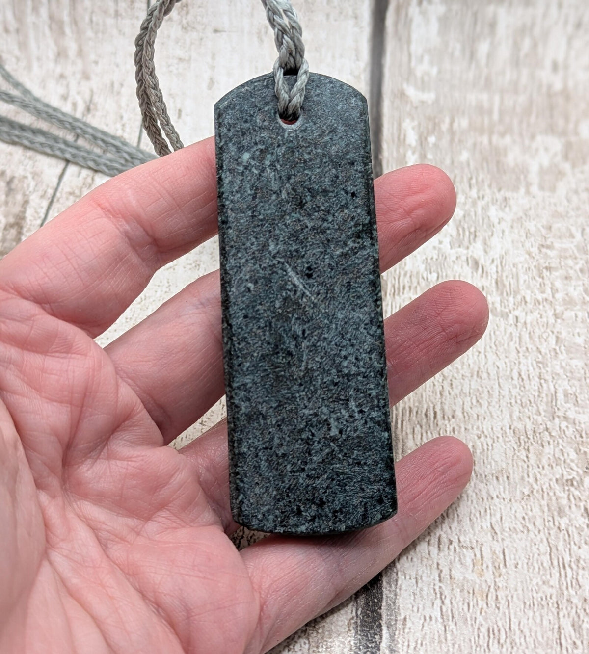 Statement preselli bluestone koru spiral pendant.