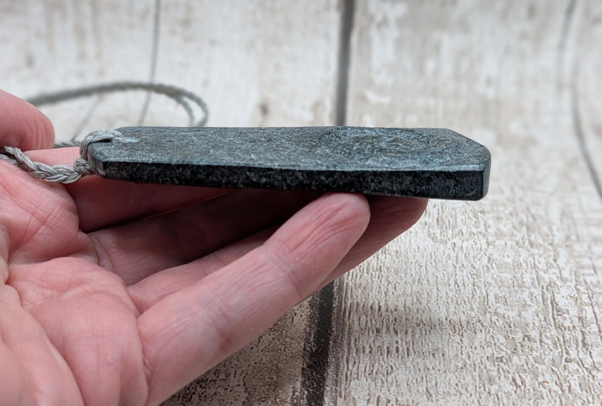 Statement preselli bluestone koru spiral pendant.