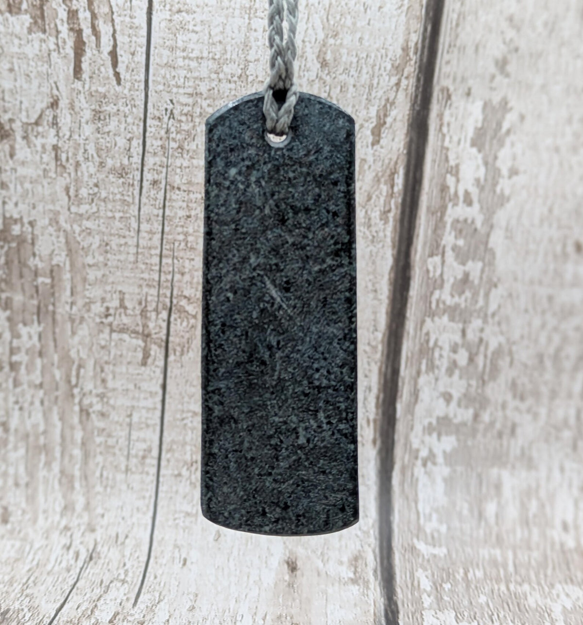 Statement preselli bluestone koru spiral pendant.