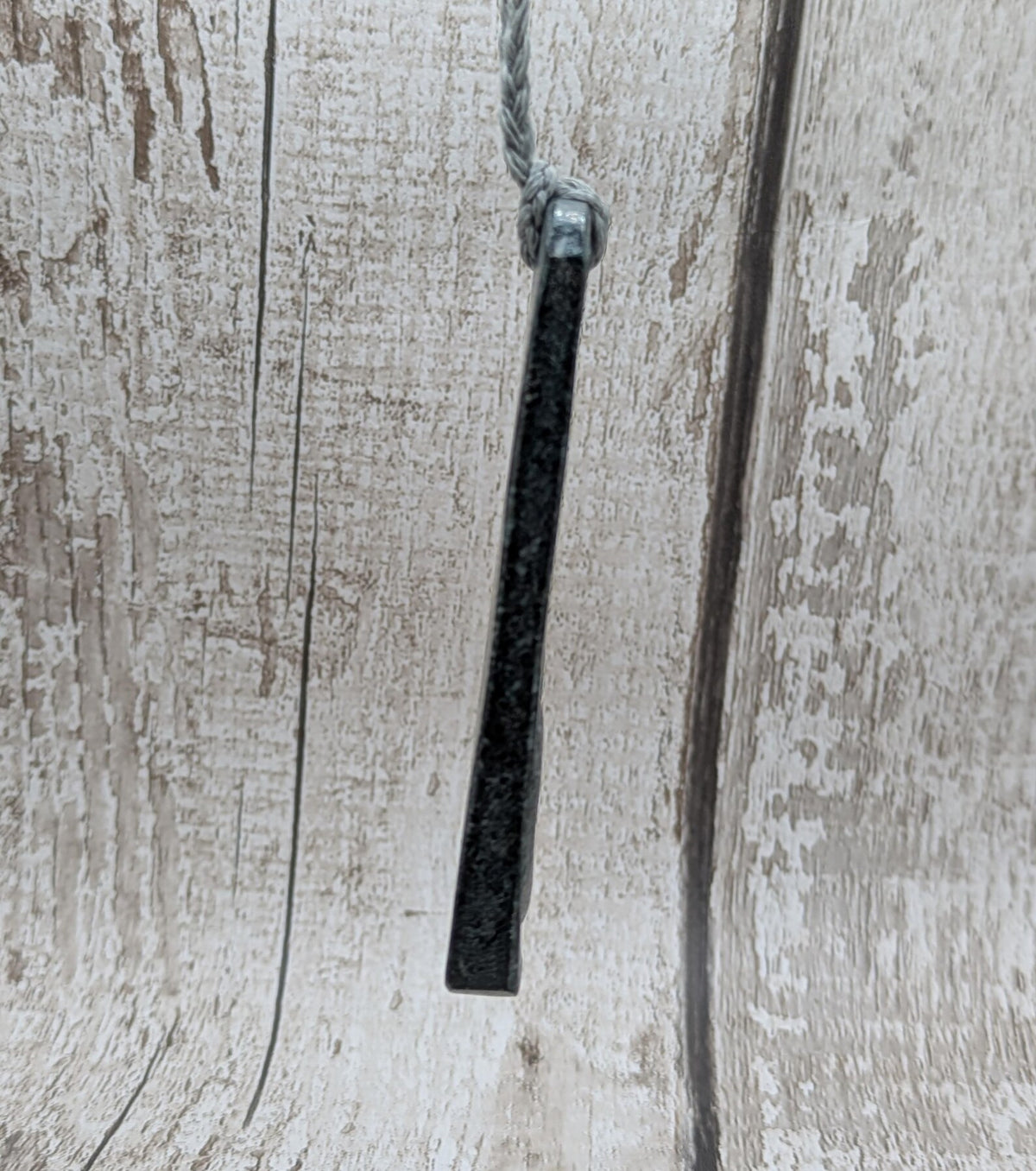 Statement preselli bluestone koru spiral pendant.
