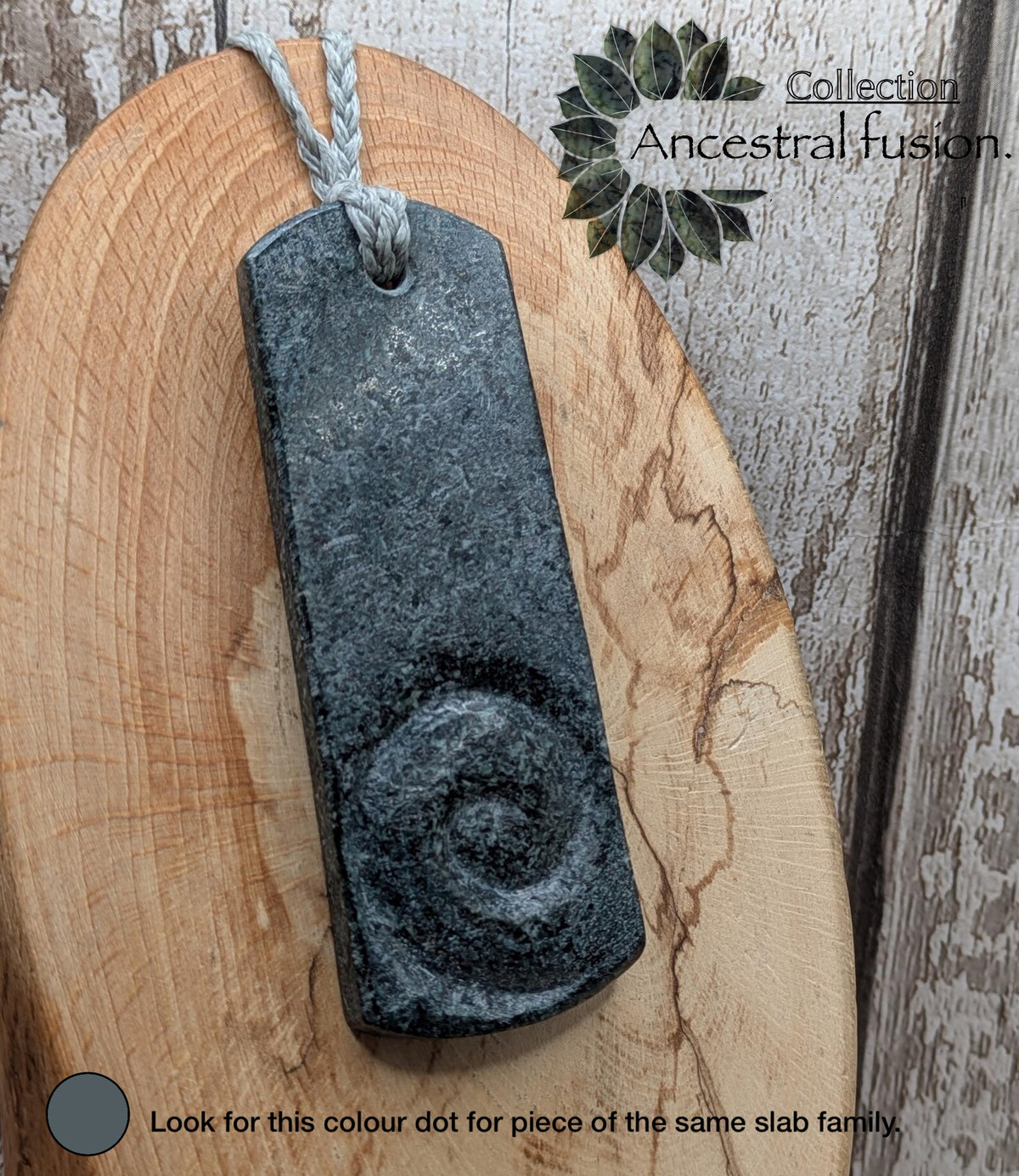 Statement preselli bluestone koru spiral pendant.