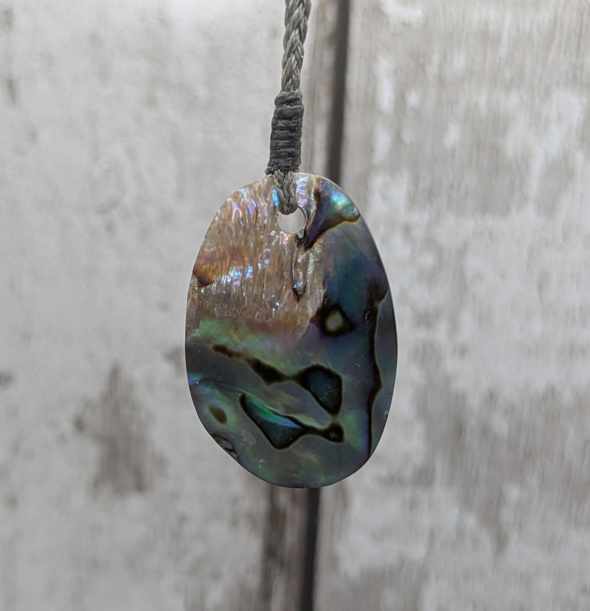 New Zealand pāua shell oval pendant.